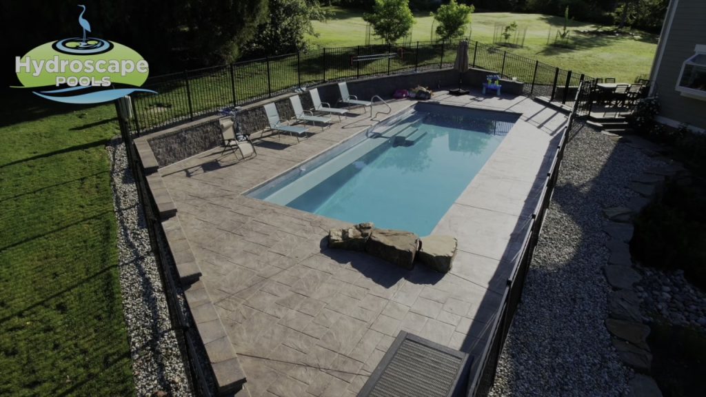 Fiberglass Pool & Paver Patio | Newtown, PA | pool, stamped concrete decking and retaining wall 1